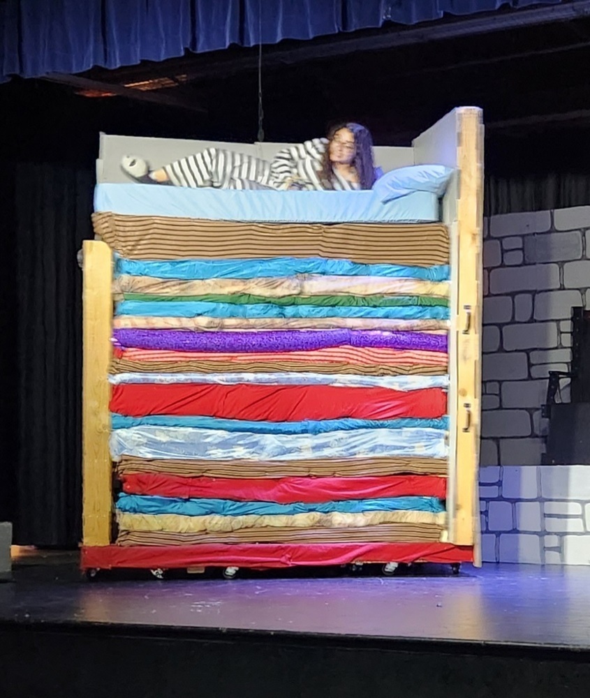 Senior Kaliyah Maupin tests out the bed in the play "Once Upon a Mattress, which will be on the Little Theater stage at MHS Wednesday through Friday.