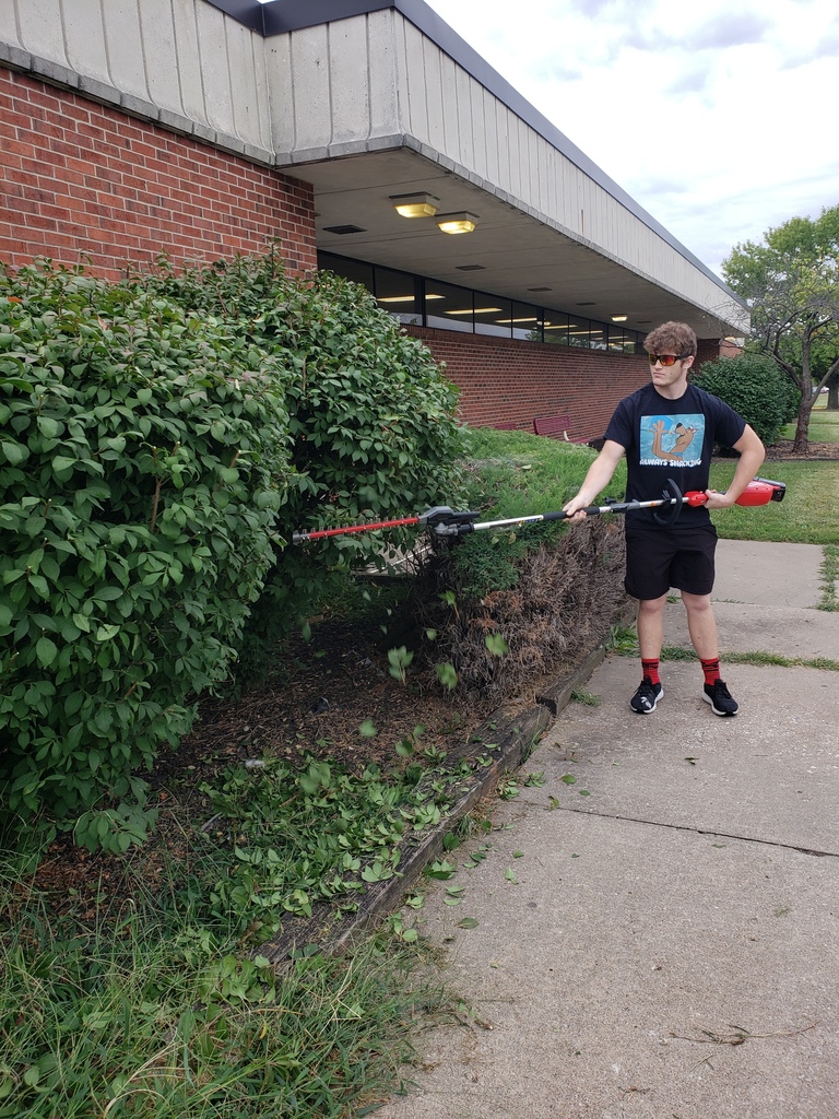 Landscaping Design Class Trimming Bushes at SCCC